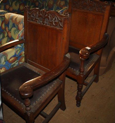 Pair of carved oak elbow chairs(-)